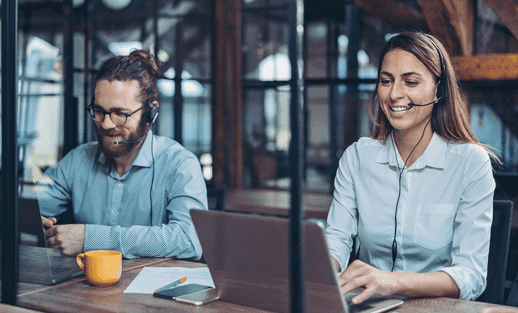 Two people from support smiling.